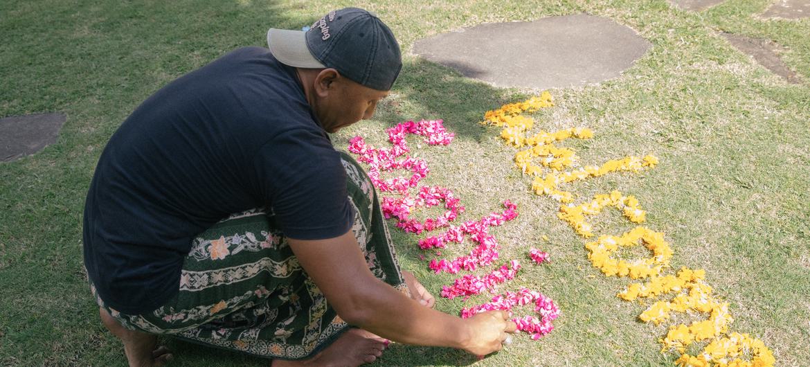 Dekha Dewandana arrange words with flowers at Esa di Kubu Homestay in Sudaji Village, Buleleng, Bali, Indonesia. Dekha Dewandana arrange words with flowers at Esa di Kubu Homestay in Sudaji Village, Buleleng, Bali, Indonesia.