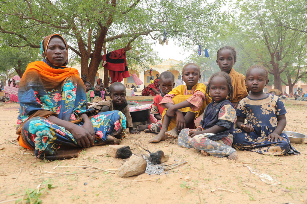 A Sudanese mother and her children take refuge in a town in Chad across the border from Darfur in Sudan. A Sudanese mother and her children take refuge in a town in Chad across the border from Darfur in Sudan.