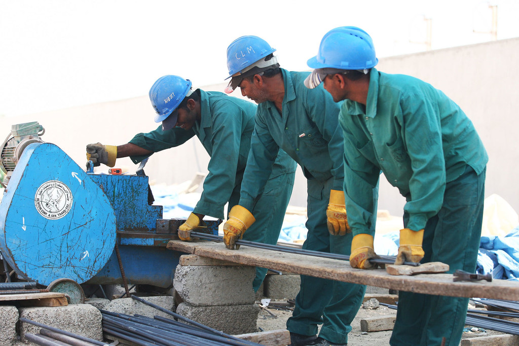 Foreign workers cut steel on a construction site in the United Arab Emirates. Foreign workers cut steel on a construction site in the United Arab Emirates.