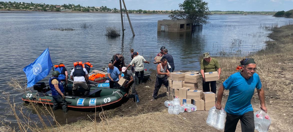 UN staff deliver life-saving water and food to some 500 families in a small village near Kherson, about 15 kilometres from the front line in Ukraine. UN staff deliver life-saving water and food to some 500 families in a small village near Kherson, about 15 kilometres from the front line in Ukraine.