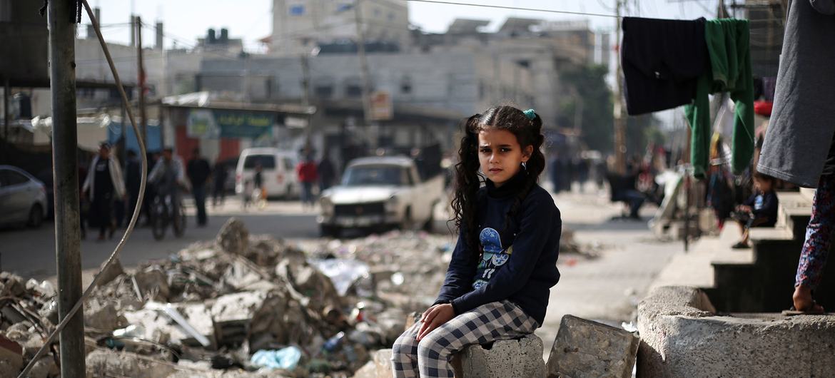 An 11-year-old girl sits on the rubble of a house in Rafah, in the southern the Gaza Strip. An 11-year-old girl sits on the rubble of a house in Rafah, in the southern the Gaza Strip.