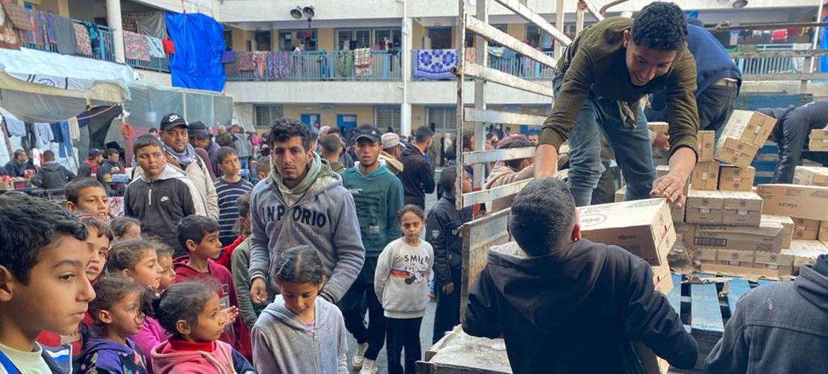 Food aid arrives at an UNRWA school-turned-shelter in Gaza. Food aid arrives at an UNRWA school-turned-shelter in Gaza.
