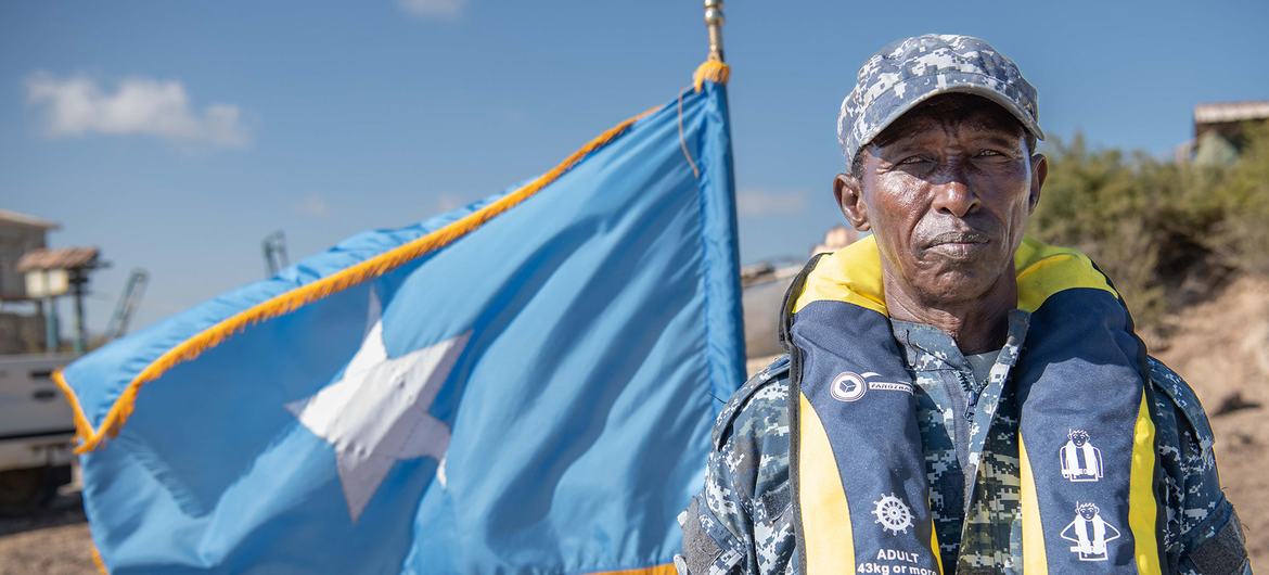 A Somali coast guard crew member at the launch of a patrol boat near Mogadishu. A Somali coast guard crew member at the launch of a patrol boat near Mogadishu.