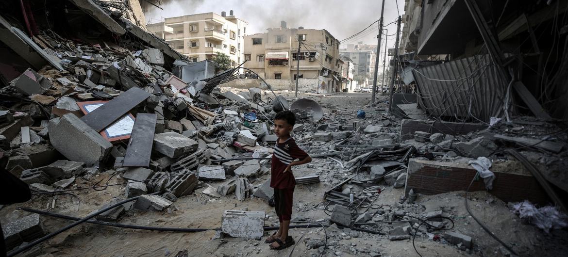A boy looks across his bombed out neighbourhood in Gaza. A boy looks across his bombed out neighbourhood in Gaza.