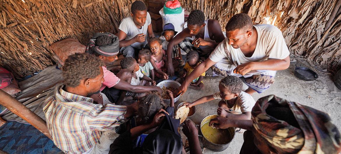 A family shares a meal in Yemen with food provided by the UN World food Programme (WFP). A family shares a meal in Yemen with food provided by the UN World food Programme (WFP).