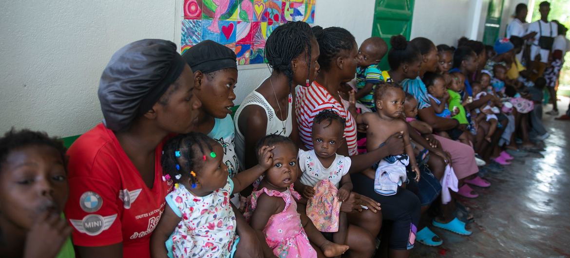 Women and their children wait at a UNICEF-supported mobile clinic in Port-au-Prince, Haiti. (file) Women and their children wait at a UNICEF-supported mobile clinic in Port-au-Prince, Haiti. (file)